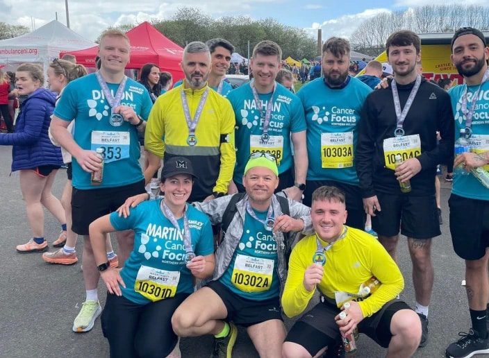 Smiley Monroe employees after completing a run for Cancer Focus charity