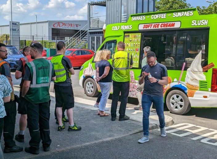 Smiley Monroe employees lining up at an ice cream van